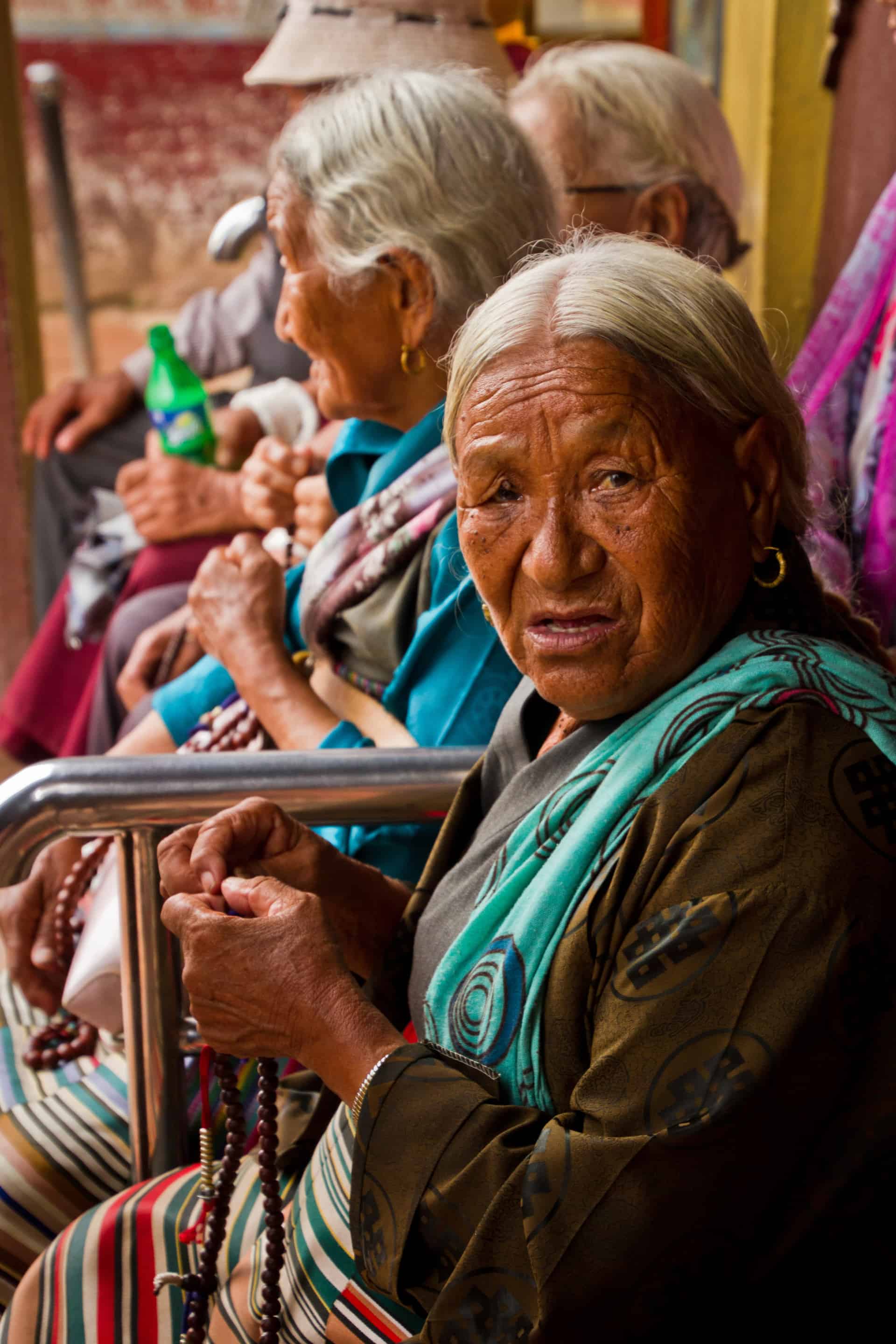 Elderly Tibetan lady of Boudhanath Temple, Kathmandu, Nepal