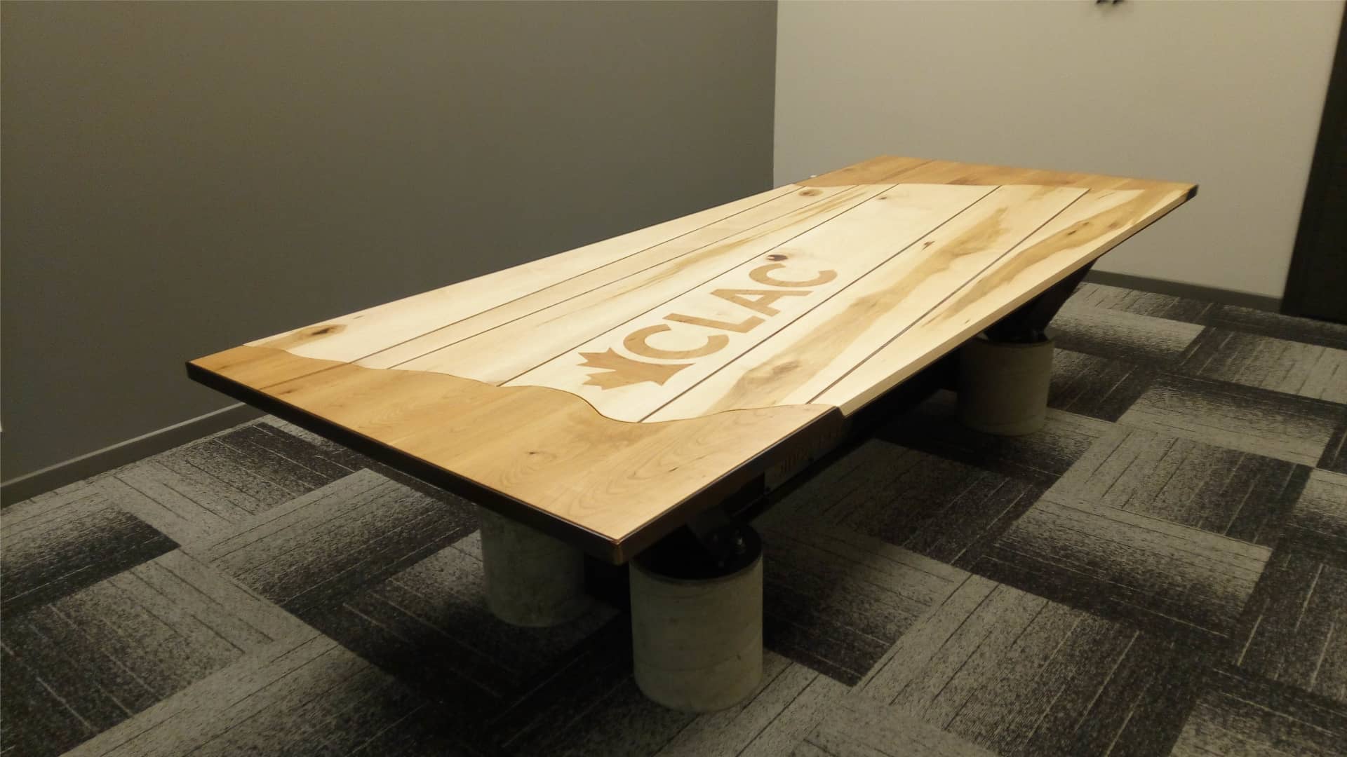 Wooden Top Boardroom Table with I-Beam Frame and Concrete Footings